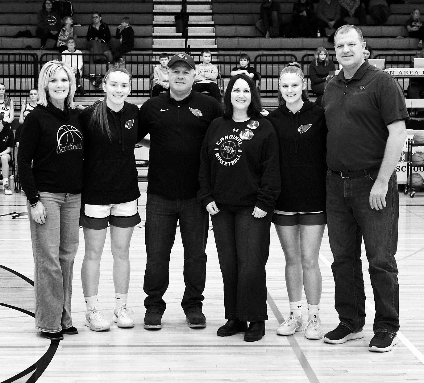 Seniors and their parents honored on Senior Night. From (L-R) Rachelle Romfo, Meredith Romfo, Troy Romfo, Katie Olson, Mikaela Olson, and Chris Olson. Photo by Larry Stokke.