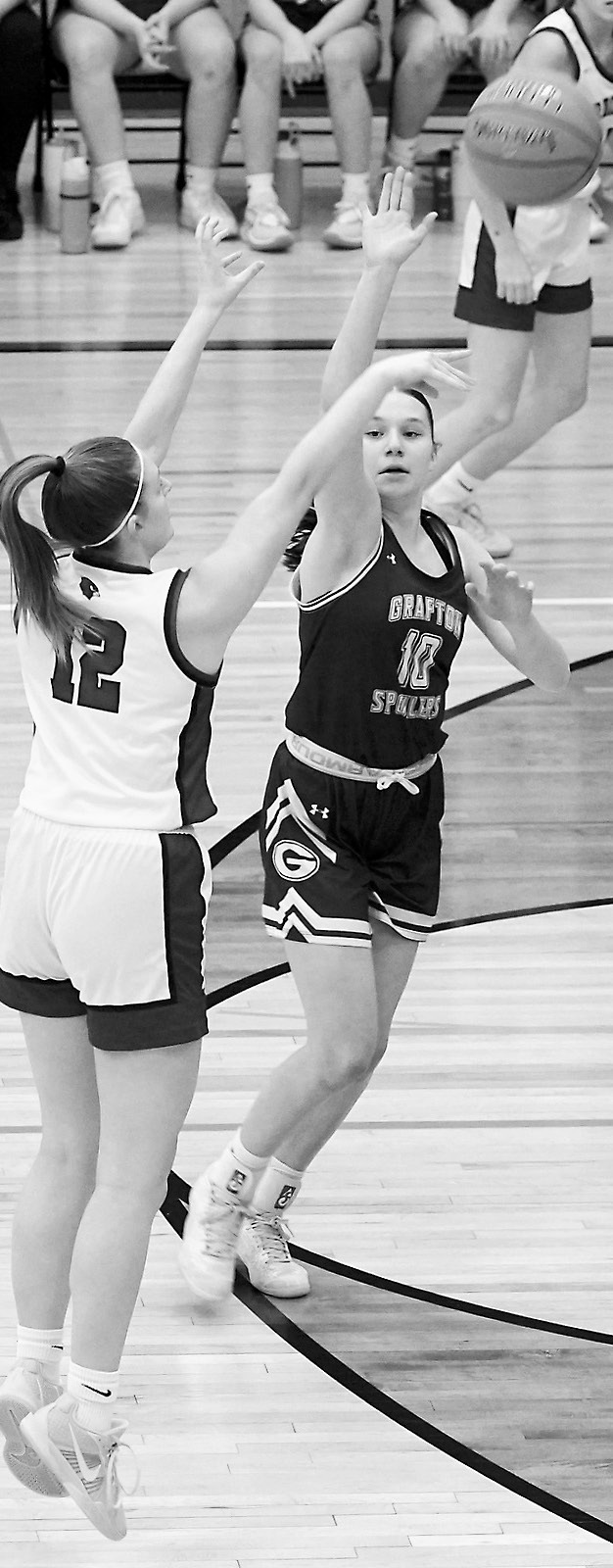 Co-Player of the Game on Senior Night, Mikaela Olson, drains a long 3-point basket. Photo by Larry Stokke.
