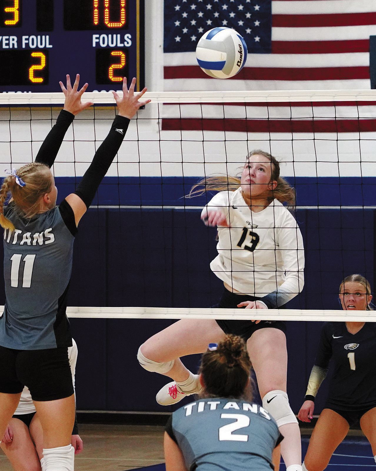 Addison Lyons had a great game against the Titans with one of her kills. Photo by Larry Stokke.