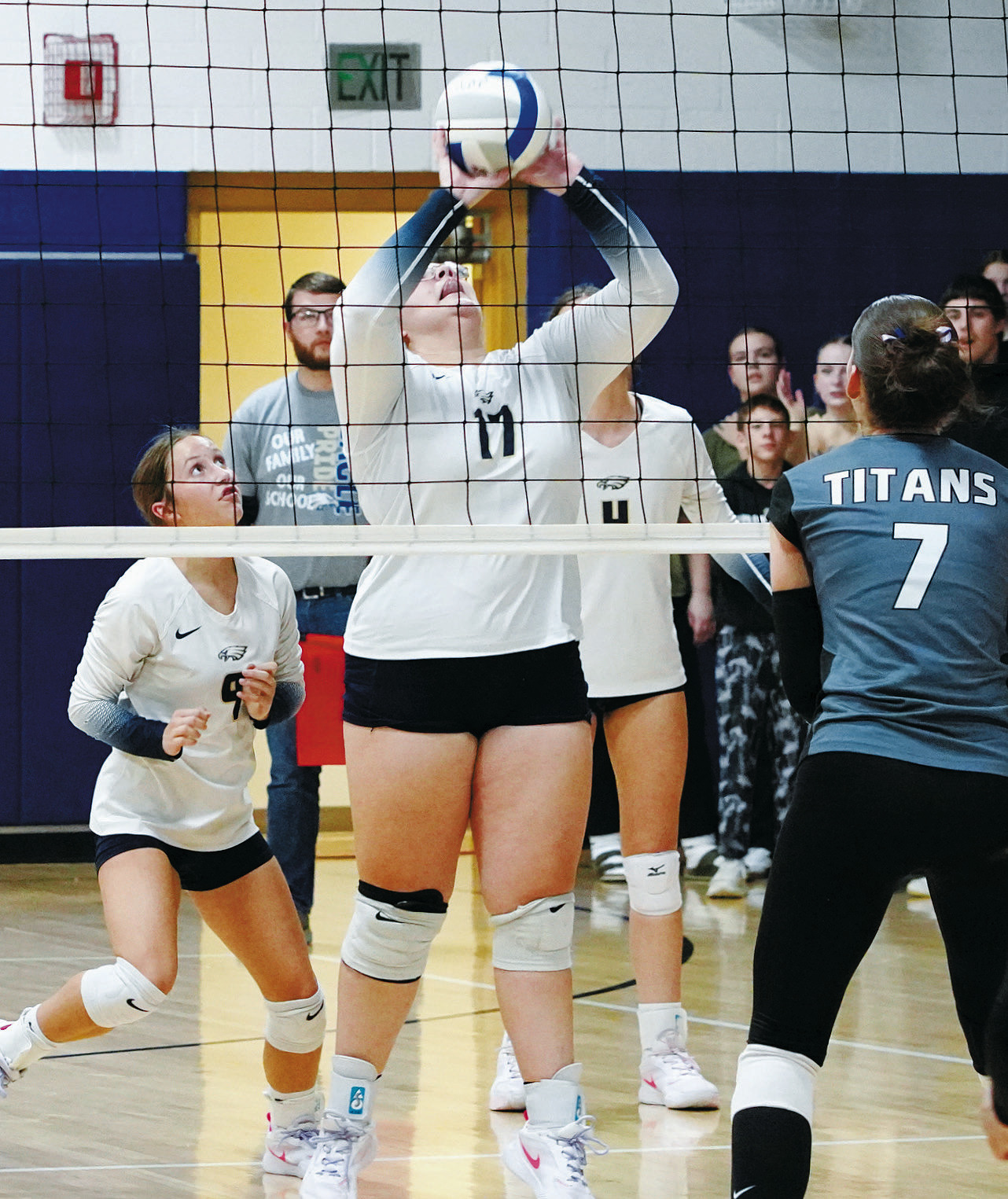 Jaelyn Forrey sends the ball back over the net for a point against the DVE Titans. Photo by Larry Stokke.