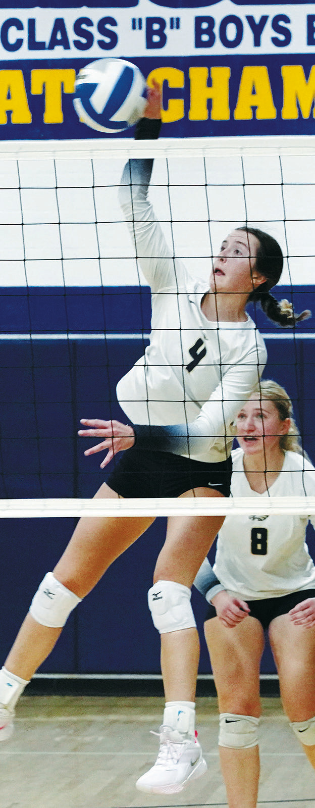 Jaelyn Johnson slams down a point against DVE in Pembina on Nov 1. Photo by Larry Stokke.