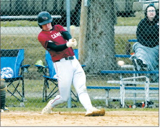 Jax Johnson connects for a base hit in the Cardinals’ game against the Grizzlies. Photo by Larry Stokke