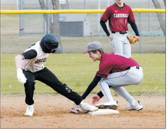 Colton Jonasson gloves the ball behind the plate in a game against the Cardinals in Munich. Photo by Larry Stokke