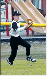 Collin Longtin makes a catch on a deep hit for an out. Photo by Larry Stokke