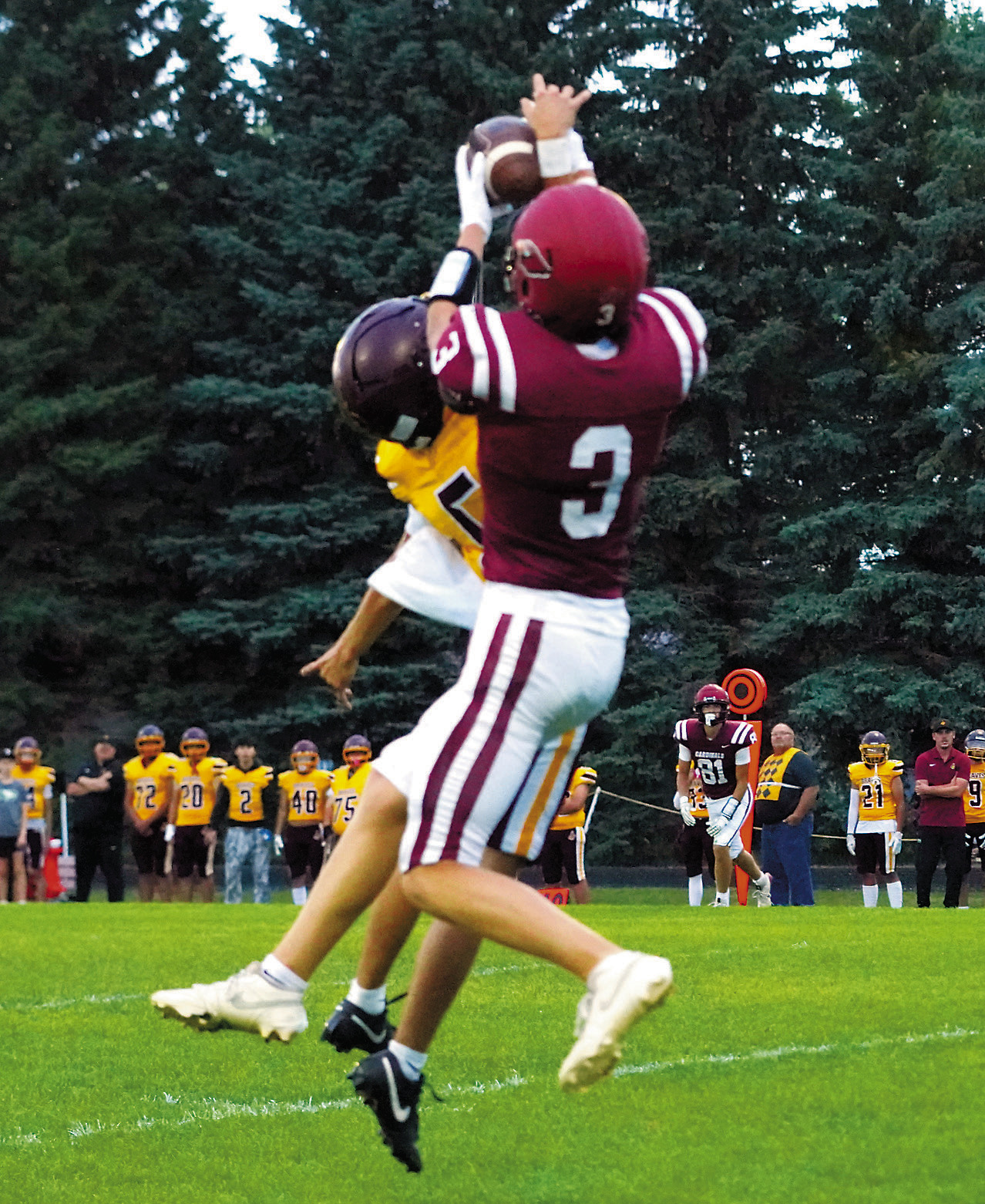 TJ Henderson makes a great catch while being pressured by a Braves defender. Photo by Larry Stokke.