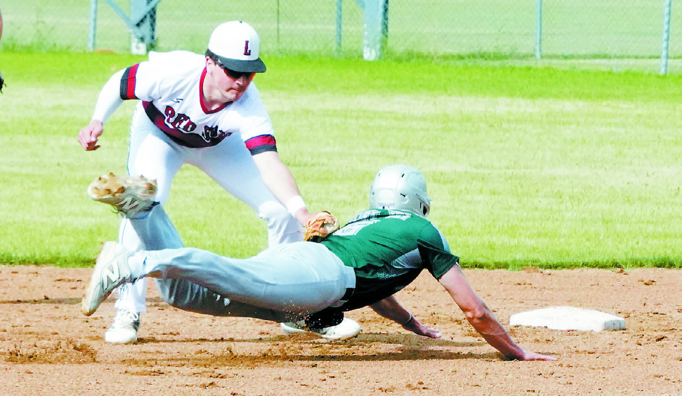 Mason Romfo successfully tags out a Thompson payer trying to get back to second base. Photo by Larry Stokke.