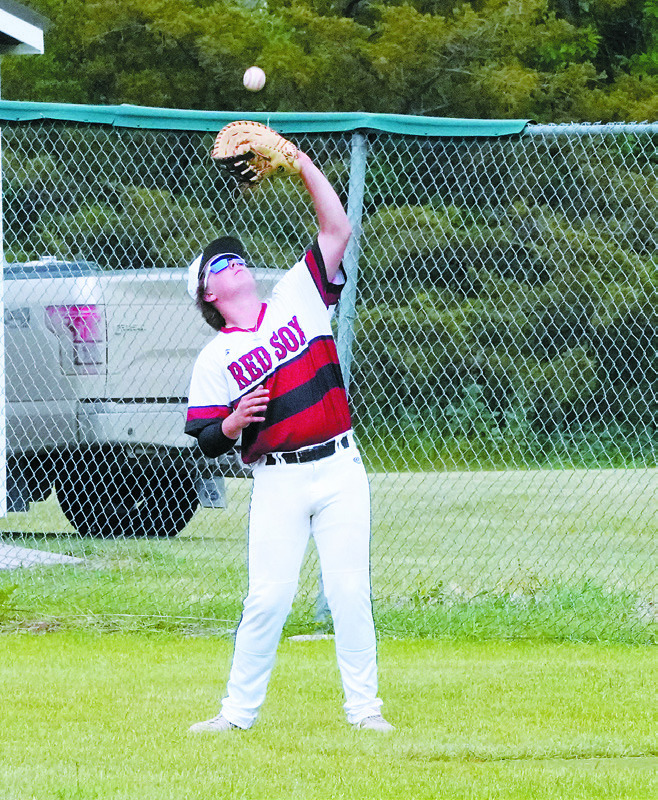 Devin Hakanson catches a pop fly during the game against Thompson on June 18. Photo by Larry Stokke.