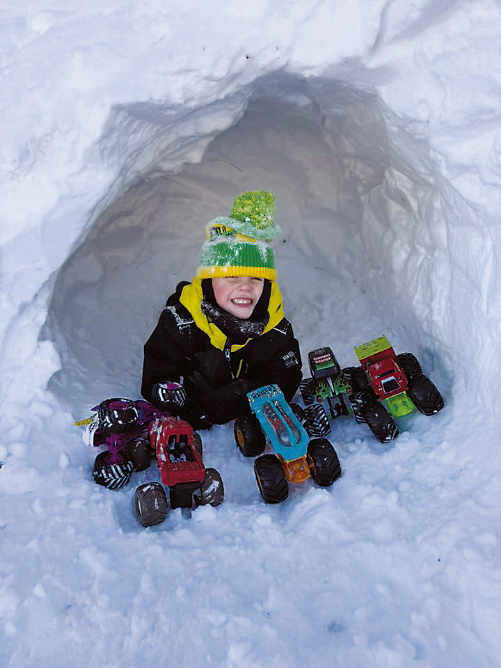 Having fun in a snow den! Photo courtesy of Samantha Howatt.