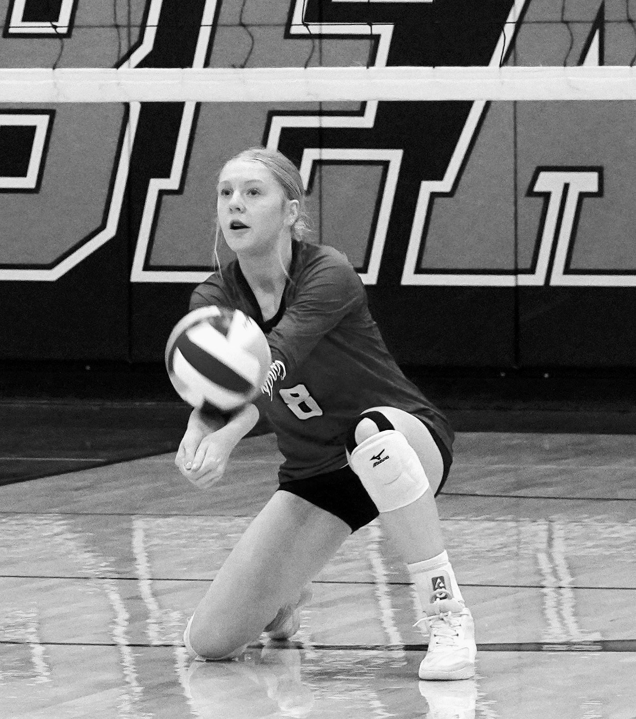 Hilary Haaven digs the ball from the back row in the Card's win over the Bearcats. Photo by Larry Stokke.