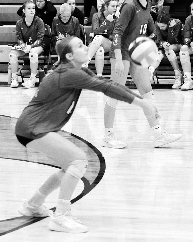 Kemi Morstad with a pass to the front row against the Bearcats. Photo by Larry Stokke.
