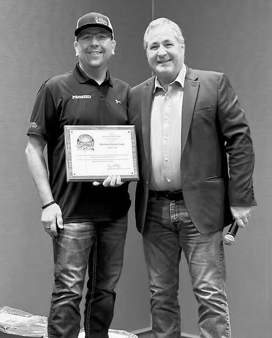 Scott Johnson, owner (left) receives 2025 North Dakota Outstanding Pesticide Dealer of the Year at the North Dakota Ag Association meeting in Fargo, N.D. from North Dakota Ag Commissioner, Doug Goehring (right). Submitted photo.