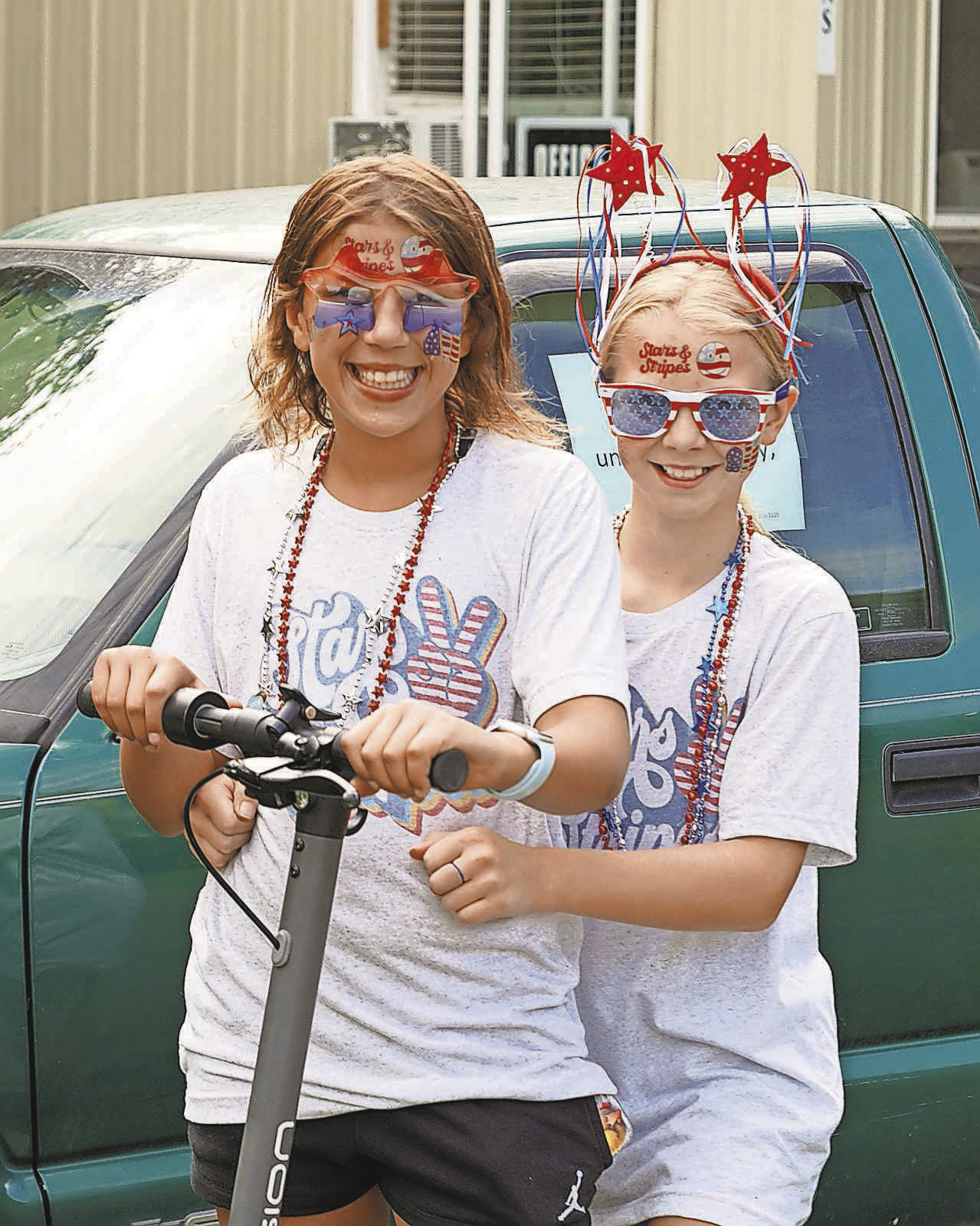Two girls enjoy the festivities offered at Mt. Carmel Dam for Independence Day weekend. PHOTO BY LARRY STOKKE
