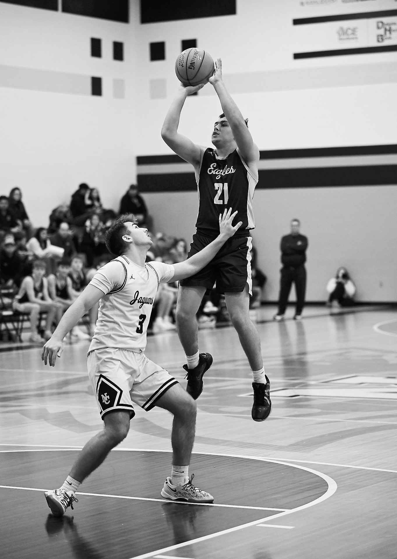Brody Berg sinks a three-pointer. Photo by Ashley Schafer.