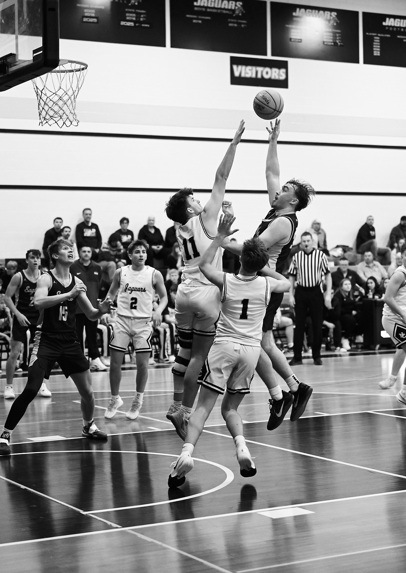 Kade Schafer battles the opponents defense and goes up for a shot. Photo by Ashley Schafer.