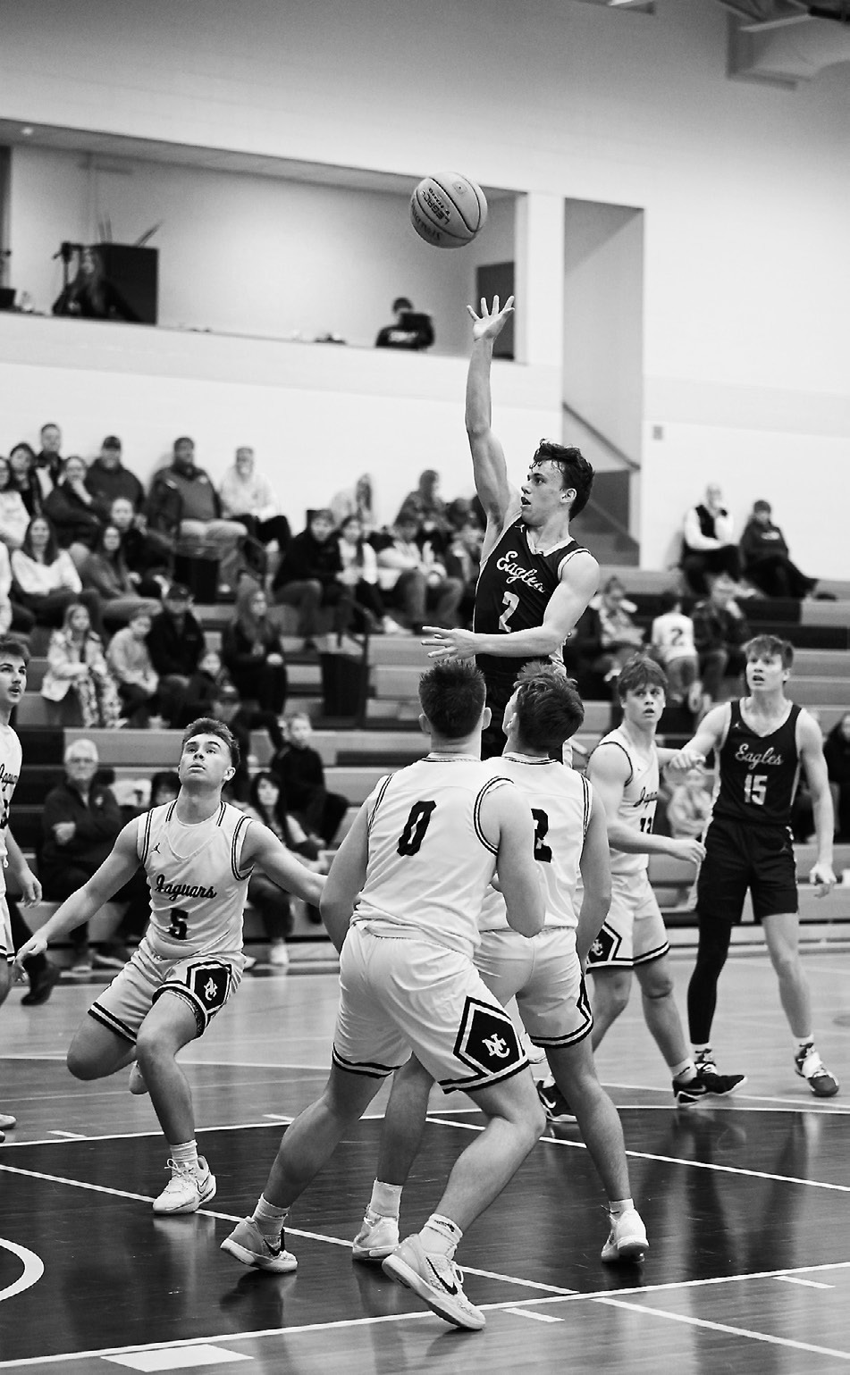 Kaden Moore goes up for a shot against the Jaguars. Photo by Ashley Schafer.