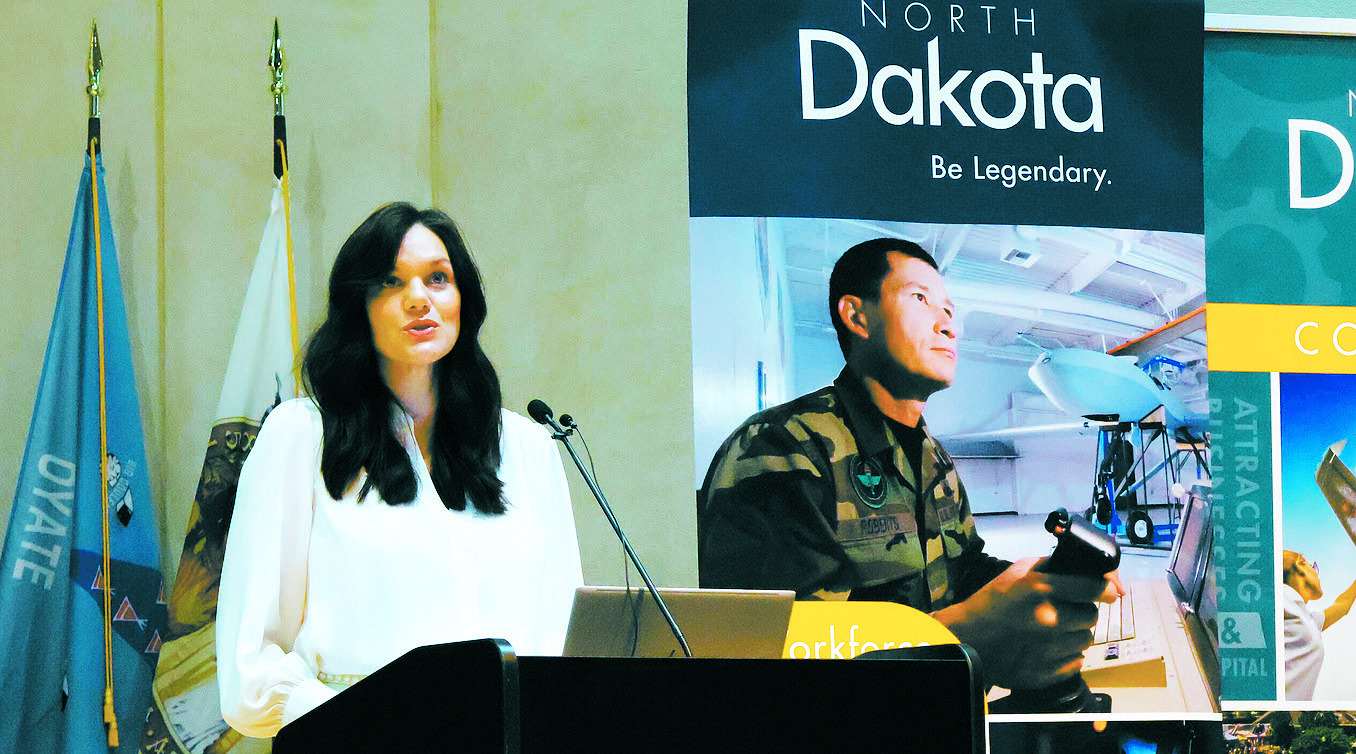 Katie Rolston Howe, director of workforce development for the North Dakota Department of Commerce, delivers remarks Aug. 21, 2024, during a Global Talent Summit at the Heritage Center that focused on workforce issues. (Michael Achterling/North Dakota Monitor)