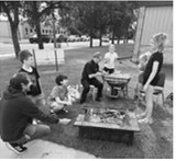 Father Kurtis Gunwall has maintained a Back to School Night tradition of serving s’mores to students. Submitted photo