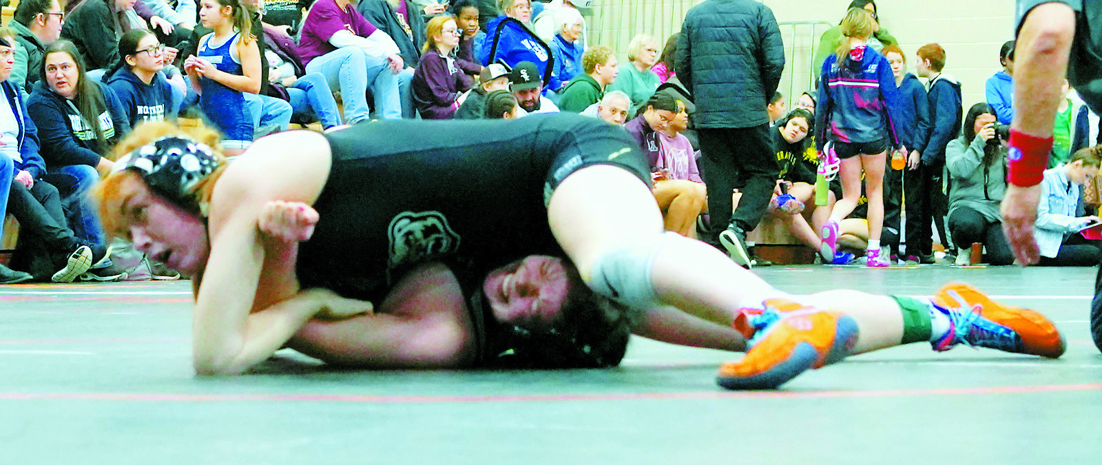 Marlie Stremick pins her opponent in the first match on her way to becoming champion in her weight class on Saturday, Jan. 25. Photo by Larry Stokke.