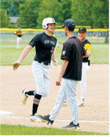 Cody Amble rounds third base after hitting the first home run of his career in the game against Park River. Photo by Larry Stokke