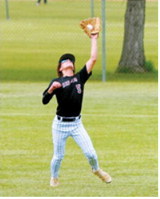 Connor Mitchell tracks down a deep fly ball in right field during action against Park River. Photo by Larry Stokke