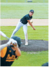 Dawson Downs delivers a pitch during Langdon's game against Park River. Photo by Larry Stokke