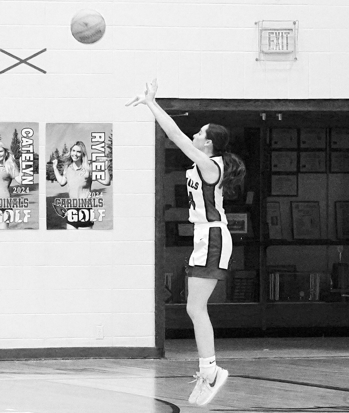 Avery Lorenz drains a three point shot in the Cards win over the Nelson County Chargers. Photo by Larry Stokke.