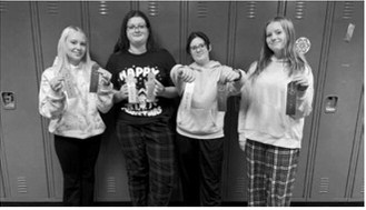 Four Langdon students competed at the meet. From left: Jaymee Reidhammer placed fourth in poetry and second place in serious prose; Matilda Lawson placed fourth in storytelling and third in impromptu; Kaydence Lundquist placed seventh in poetry and third in storytelling; and Sophie Mryvik placed second in storytelling.