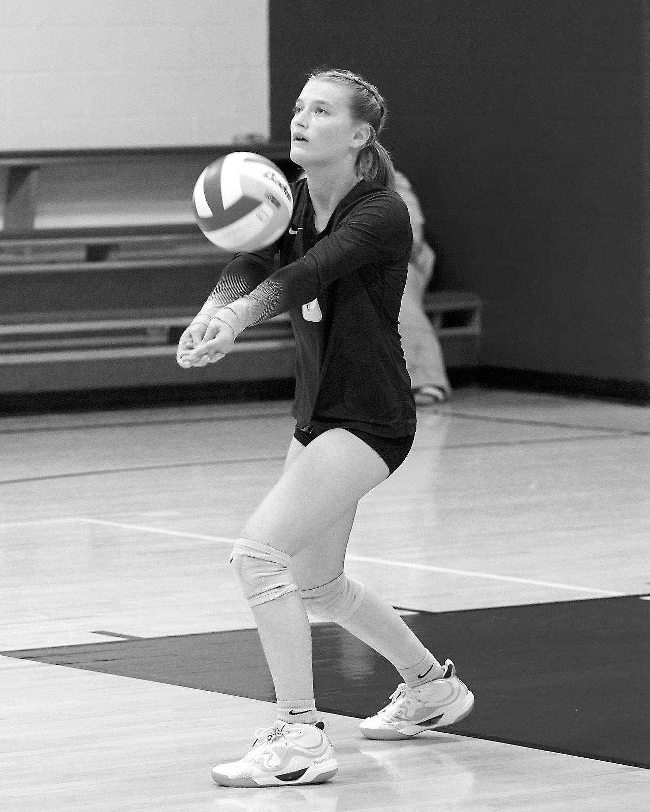 Dannika Bennett passes the ball to the front row in Pembina on Sept. 9 against the Mustangs. Photo by Larry Stokke.
