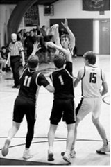 #2 Kaden Moore with a 3-point attempt in the game against Richland. Photo by Ashley Schafer