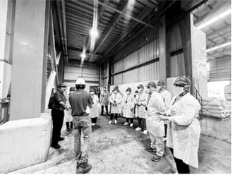 The North Dakota delegation made numerous stops, including a visit to a feed mill. ND Soybean Council photo