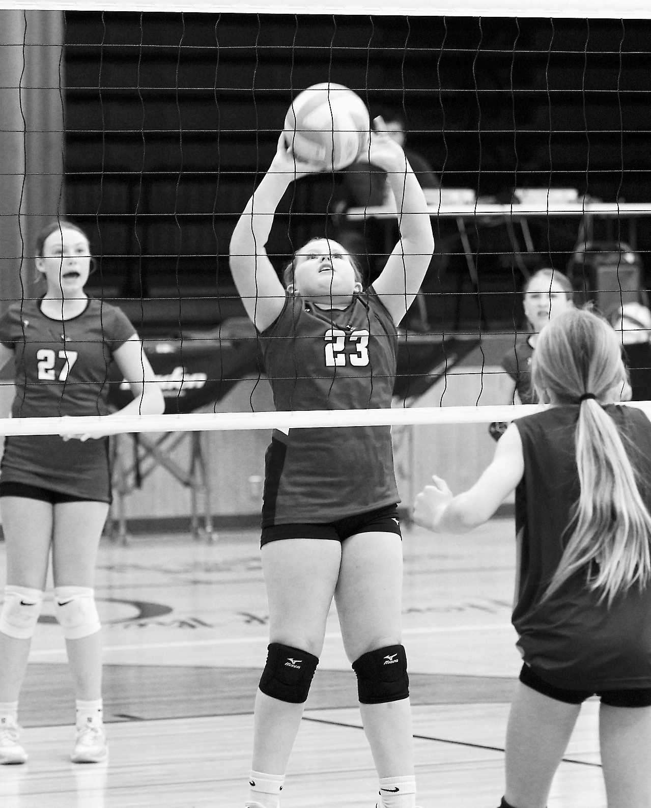 Lexi Martin flips the ball back over the net in the Cards’ win over Lakota on April 24 in Langdon. Photo by Larry Stokke.