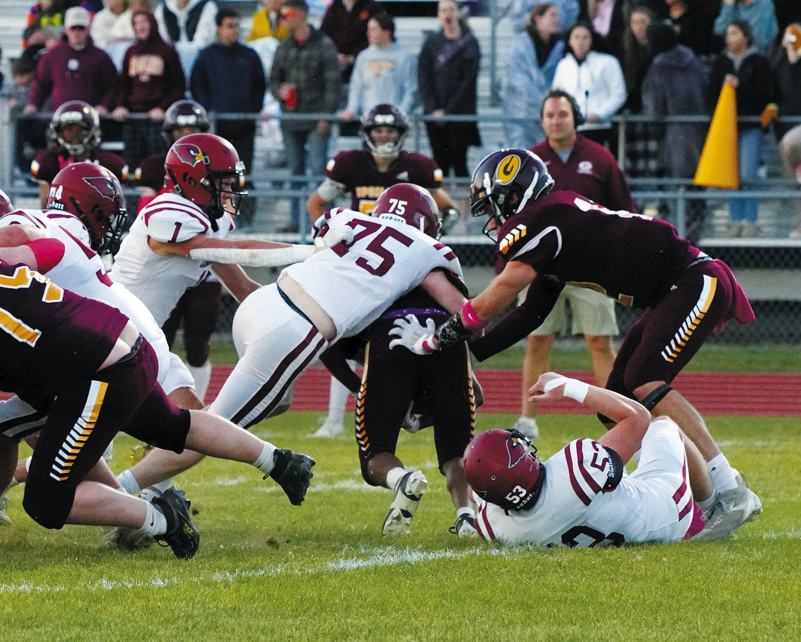 Keaton Ullyott tackles a Spoiler ball carrier for a turnover in downs. Photo by Larry Stokke.