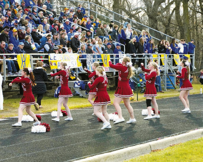 The Cardinal Cheer Squad kept fans fired up at the game against Velva. Photo by Larry Stokke.