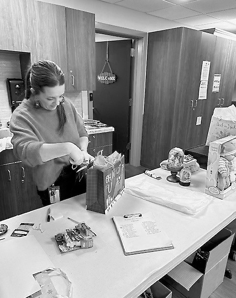 Kelsey displaying her fantastic gift wrapping skills.