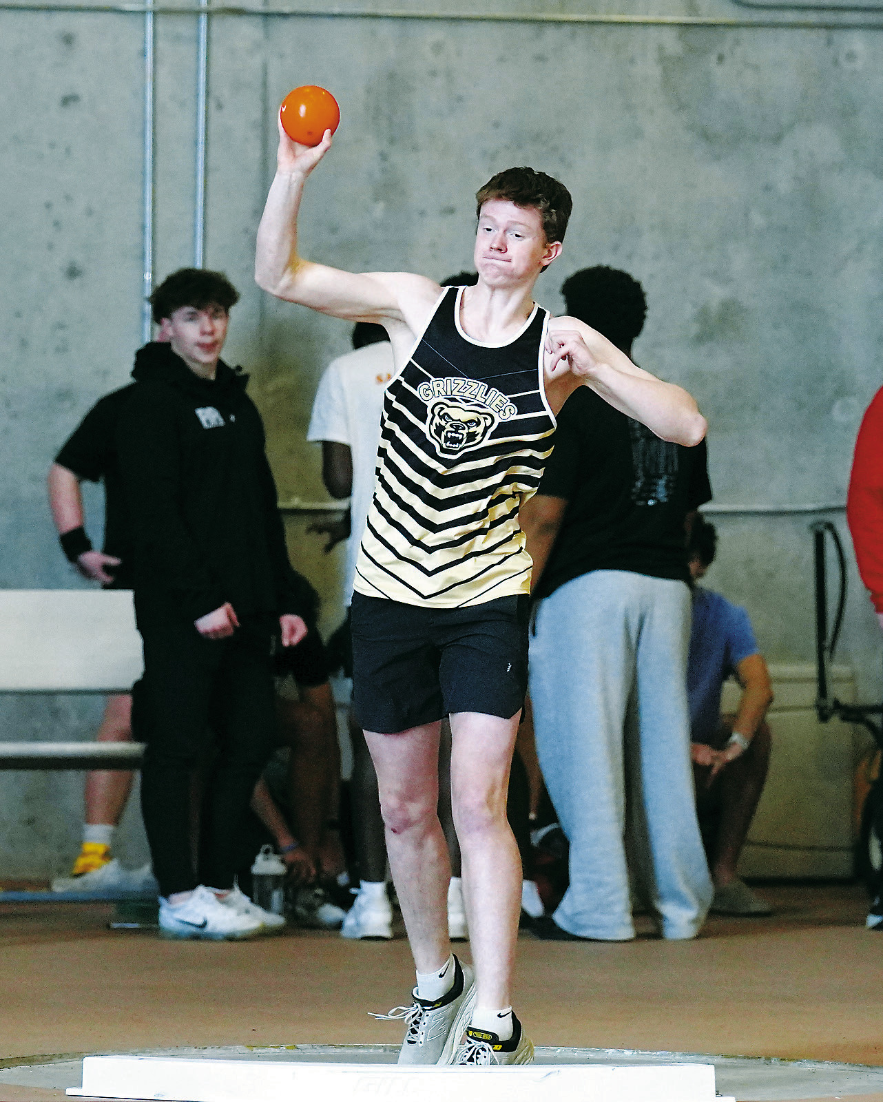 Bjorn Evenson competes in the shot-put event at Grand Forks’ indoor track meet. Photo by Larry Stokke