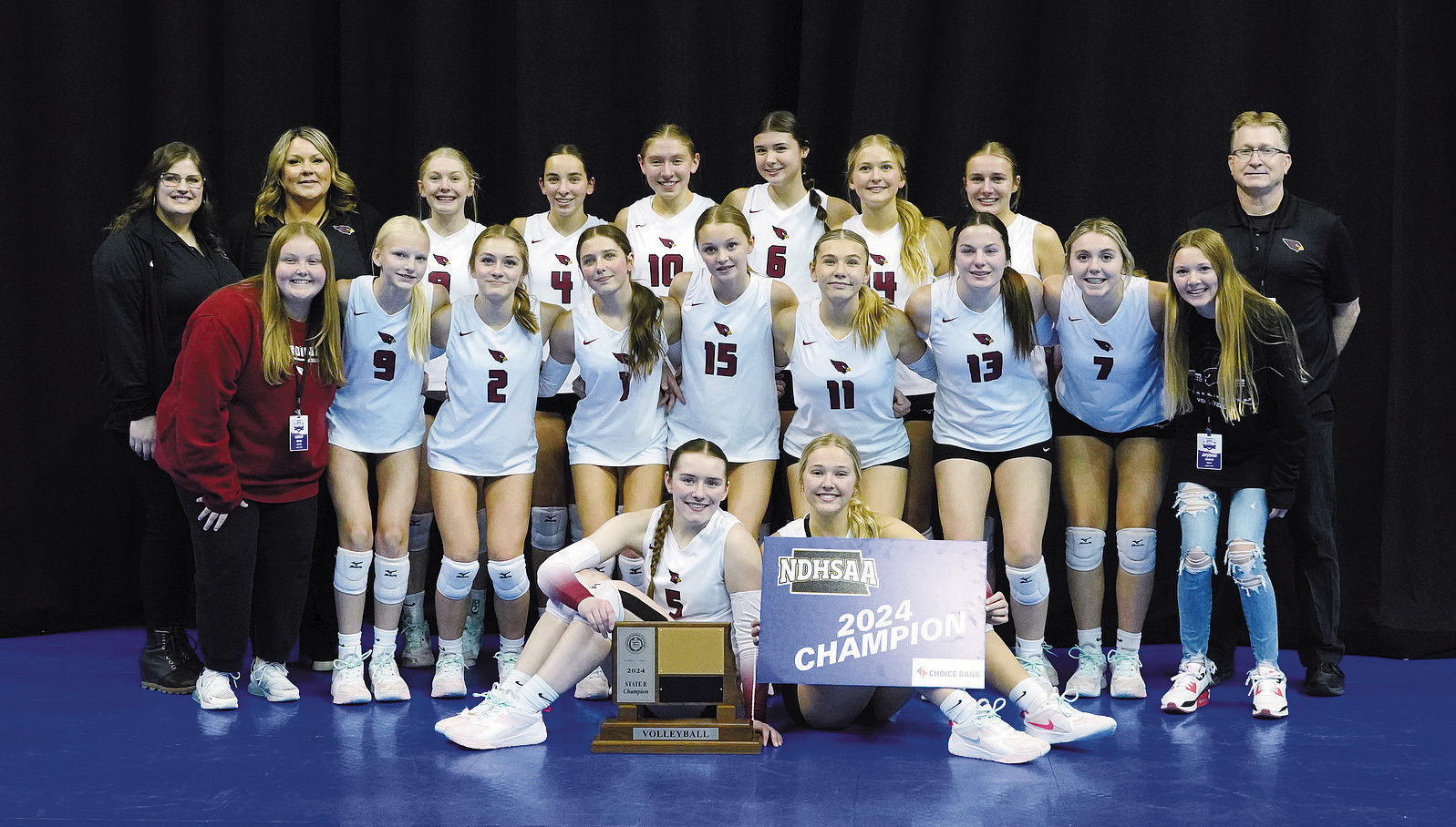The 2024 Class B State Champs: Back row (L-R) Taylor Benneweis, Aubree Page, Hilary Haaven, Avery Lorenz, Aubrey Badding, Taya Feist, Emma Hall, Kemi Morstad, Rich Olson; middle row (L-R) Haven Radway, Mya Swanson, Ella Goodman, Meggy Hetletved, Hallie Overby, Raeleigh Ratzlaff, Erika Bakke, Viv Prouty, AryAnna Schaefer; front row (L-R) Meredith Romfo and Payton Hall Photo by Larry Stokke.