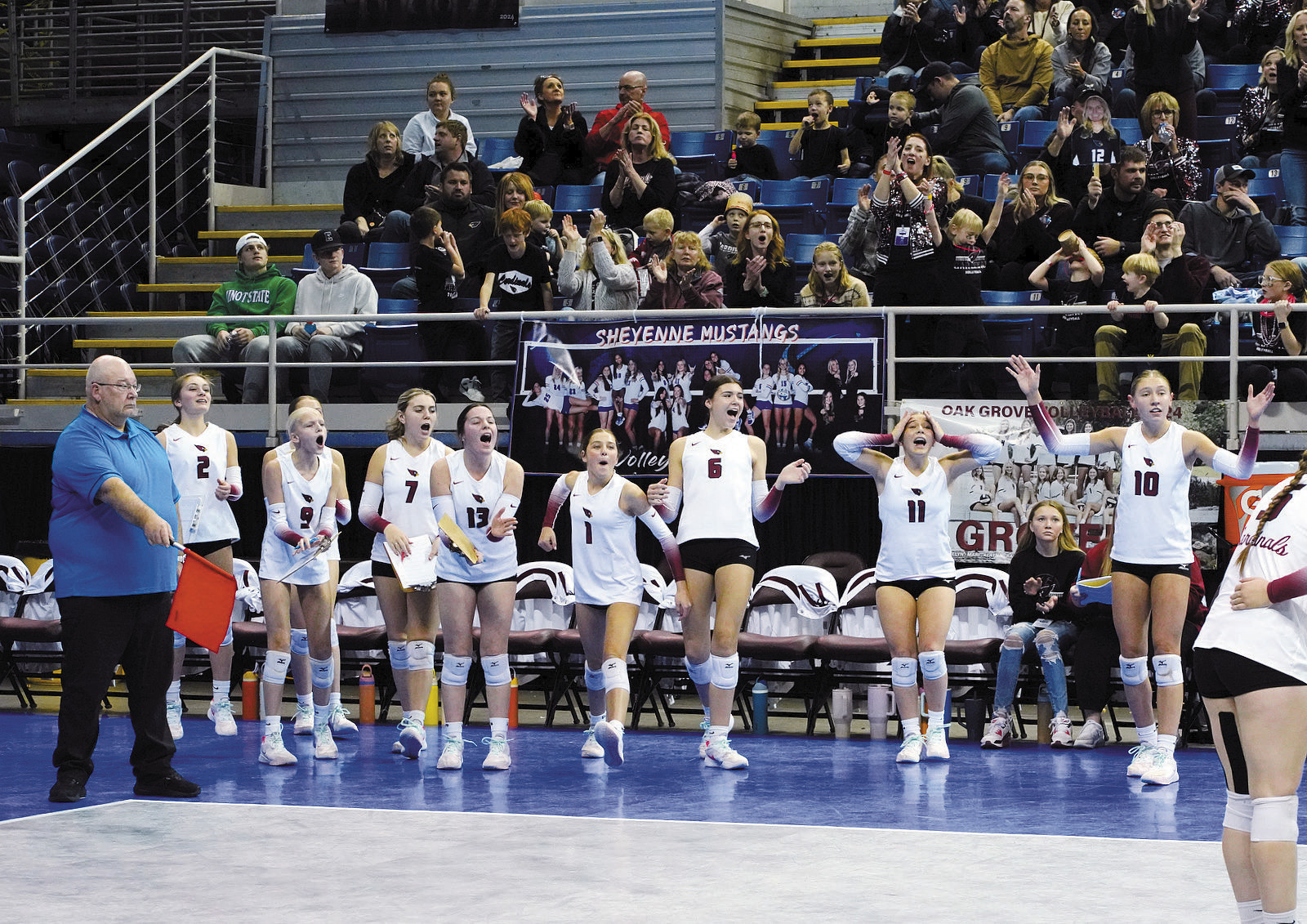 During a roller coaster of a game, the bench oscillated between stressing, screaming, and cheering in support of their teammates. Photo by Larry Stokke.