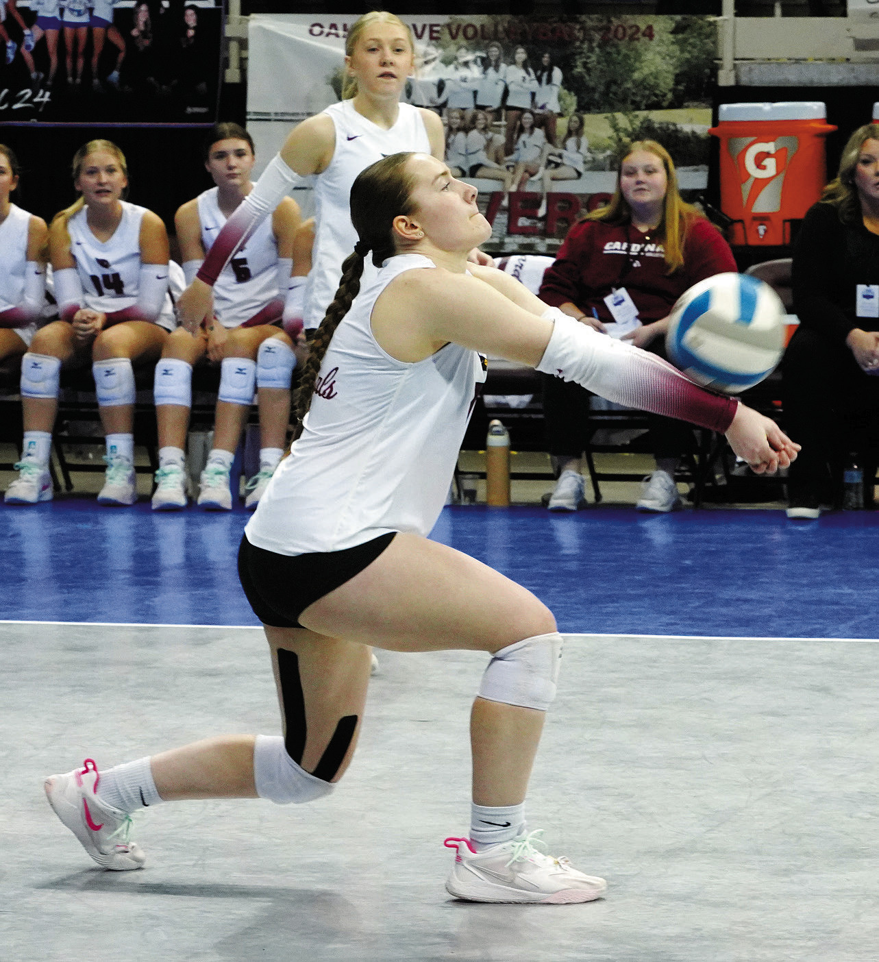Meredith Romfo makes contact with the ball at the Class B state championship. Photo by Larry Stokke.