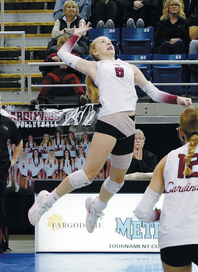 Hilary Haaven takes a massive leap to make contact with the ball. Photo by Larry Stokke.