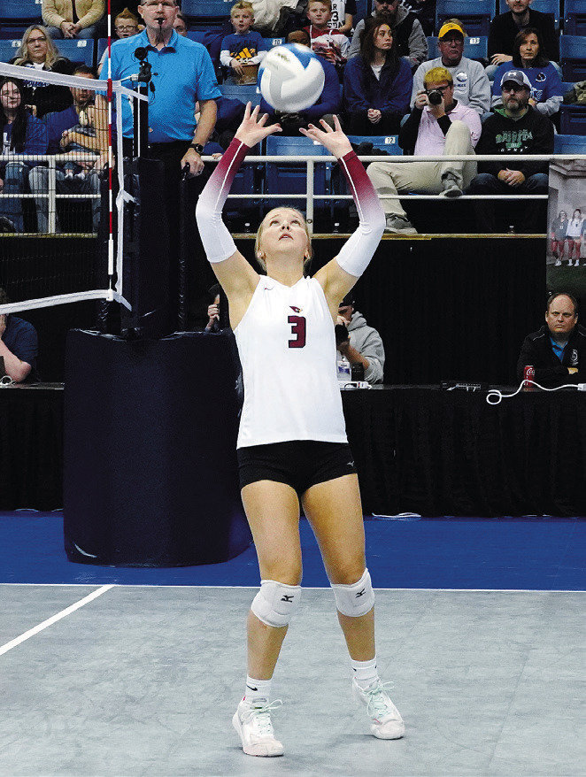 Payton Hall sets the ball for a teammate. Photo by Larry Stokke.