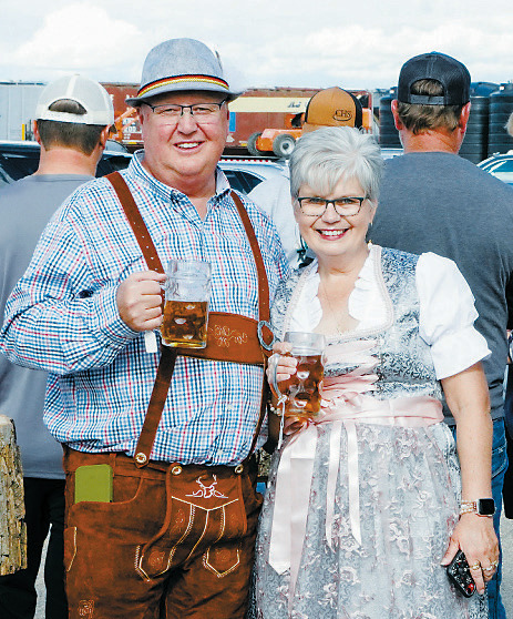 Mark and Kyza Zimmer pose together for a photo at last year’s Oktoberfest in Munich. Fundraising for the community event is underway with a meat raffle on Monday, June 30 at the Munich City Plaza. Photo by Larry Stokke.