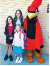 Amelia, a third-grader, left, and Aubrey, a first-grader, pose with Mrs. Bata and the Cardinal mascot on the first day of school at Langdon Area Elementary School. Photo courtesy of Jackie Dvorak