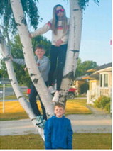 Parker Domres, top, and Ryker Domres, center, both seventh-graders, and Tucker Domres, a fourth-grader, are ready for a new school year at St. Alphonsus School in Langdon. Photo courtesy of Kayla Domres