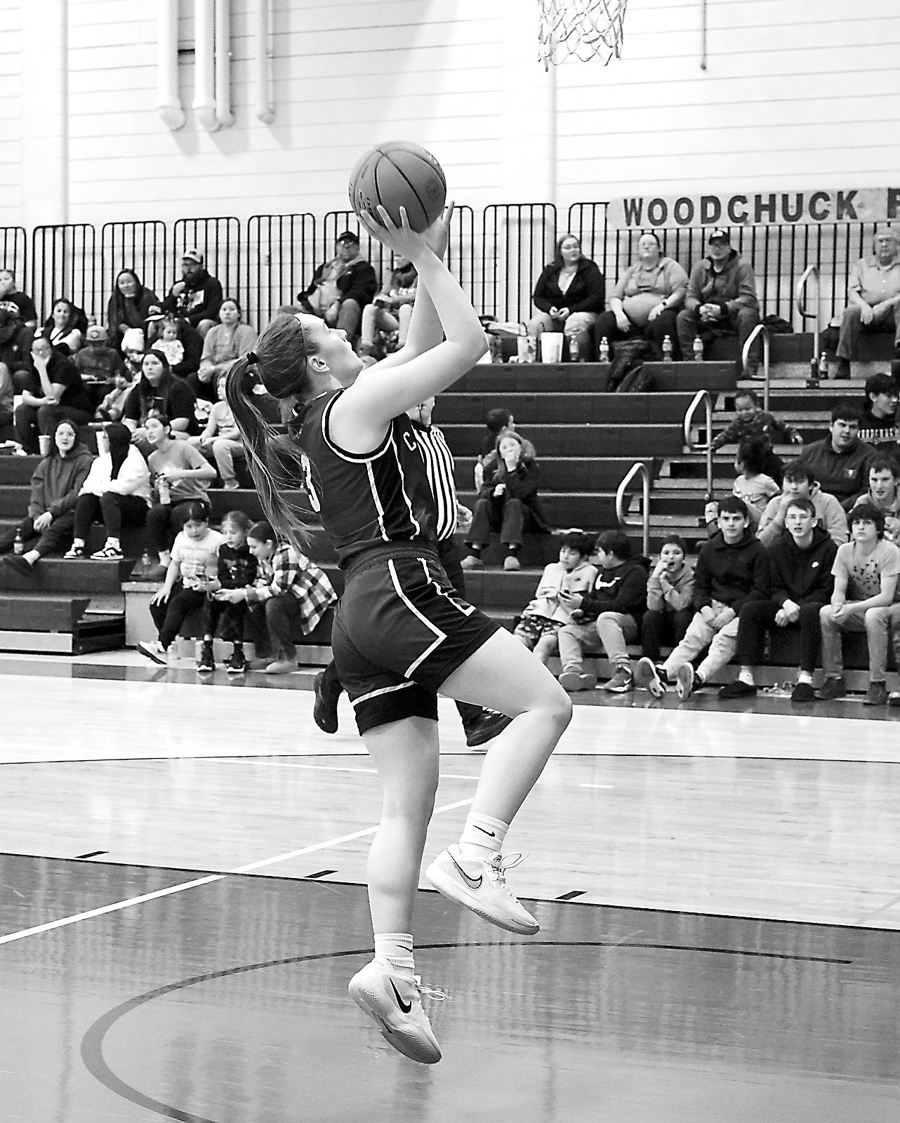 Meredith Romfo drops in a layup to finish the night with three 3-point baskets for a total of 26 points. Photo by Larry Stokke.