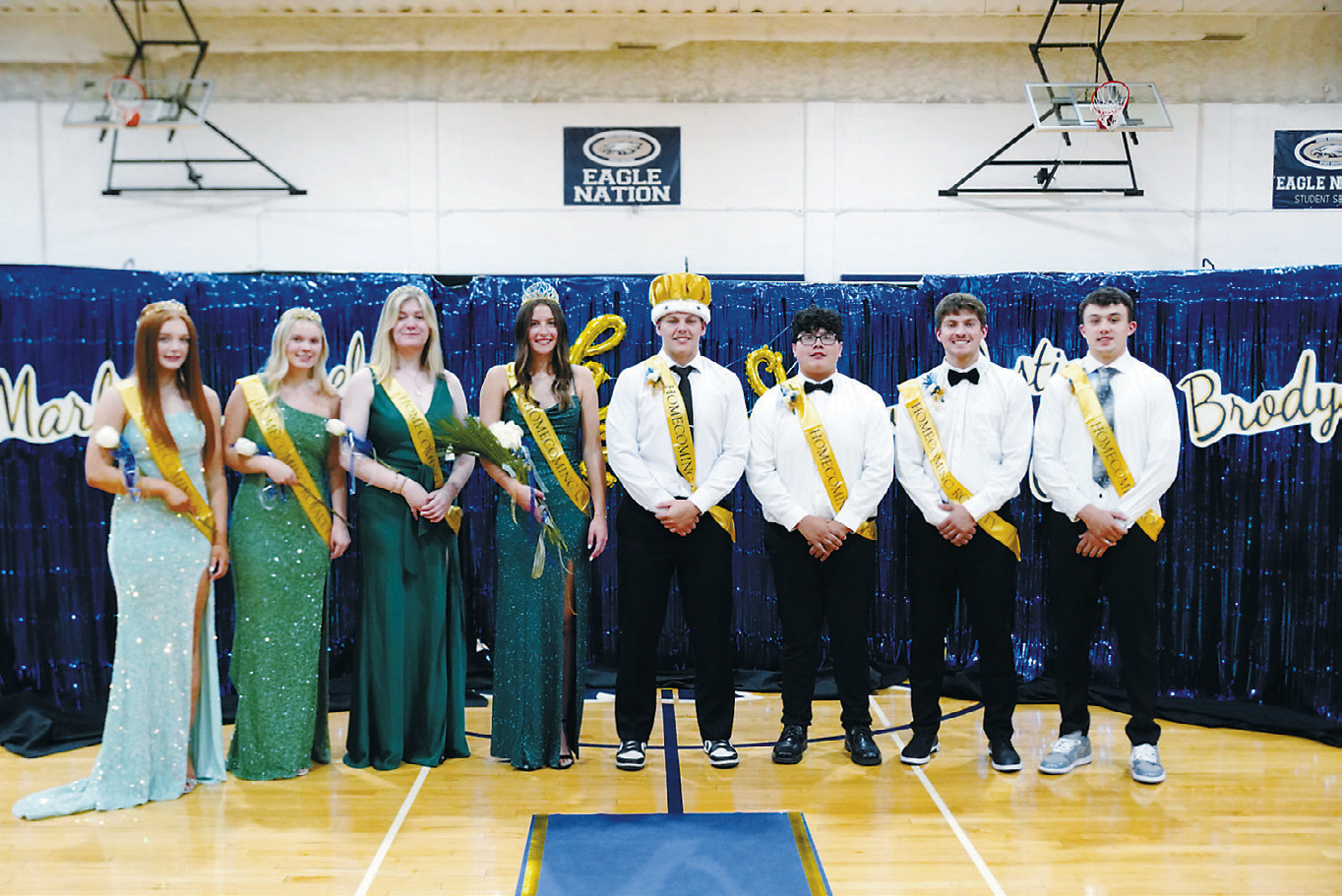 Walhalla Homecoming Court (L-R) Marlie Stremick, Jacy Fraser, Gracyn Horning, Queen Jaelyn Johnson, King Gavin Symington, Dustin Miller, Colton Bailly, and Brody Berg. Photo by Larry Stokke.