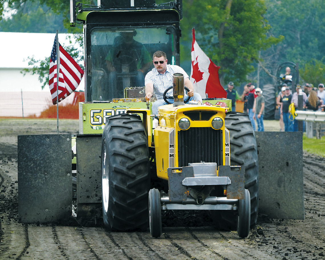 Reily Bata took home two wins and a fourth place landing at the tractor pull in Mountain. Photo by Larry Stokke.