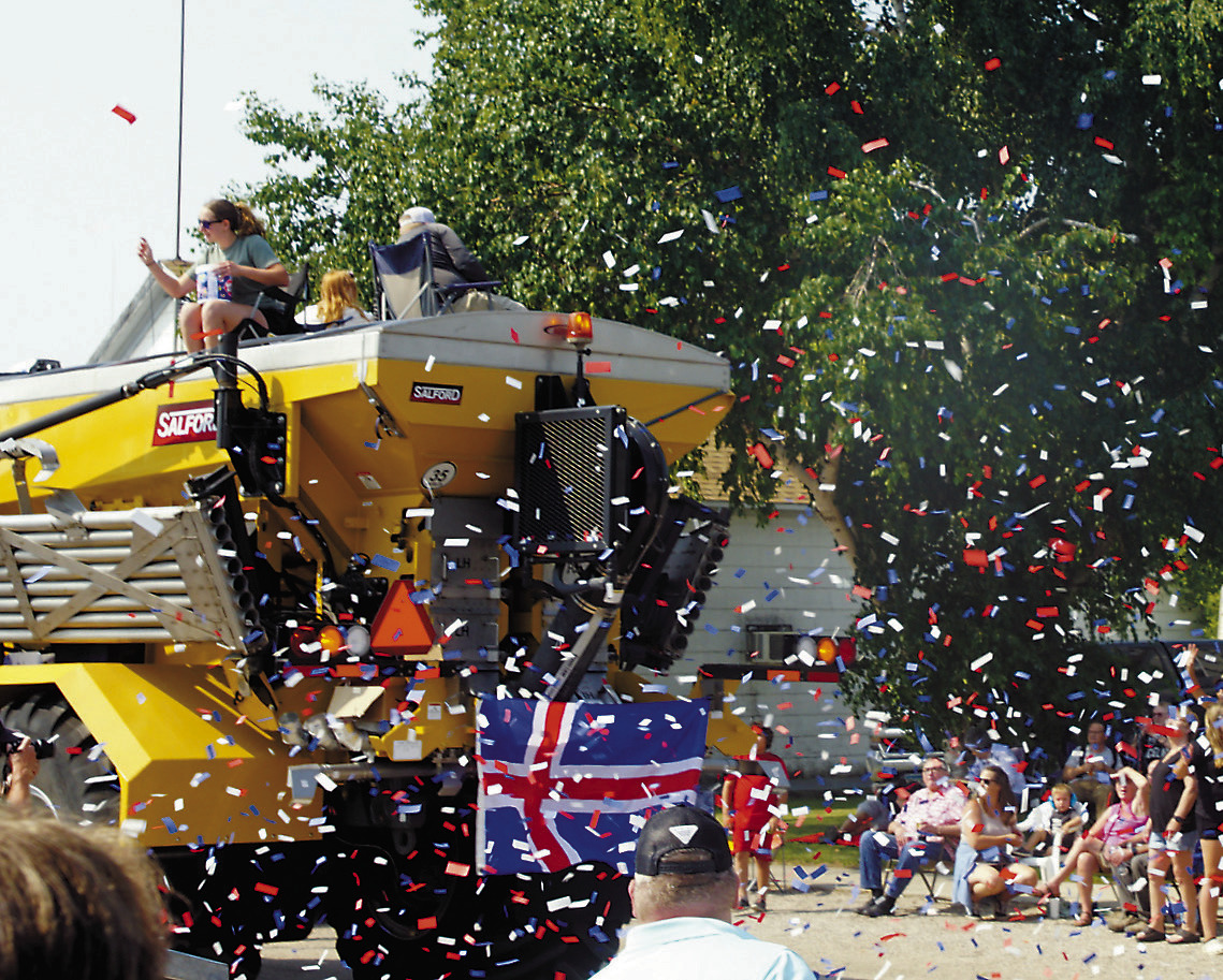 Confetti flies at the Deuce of August's annual parade. Photo by Larry Stokke.
