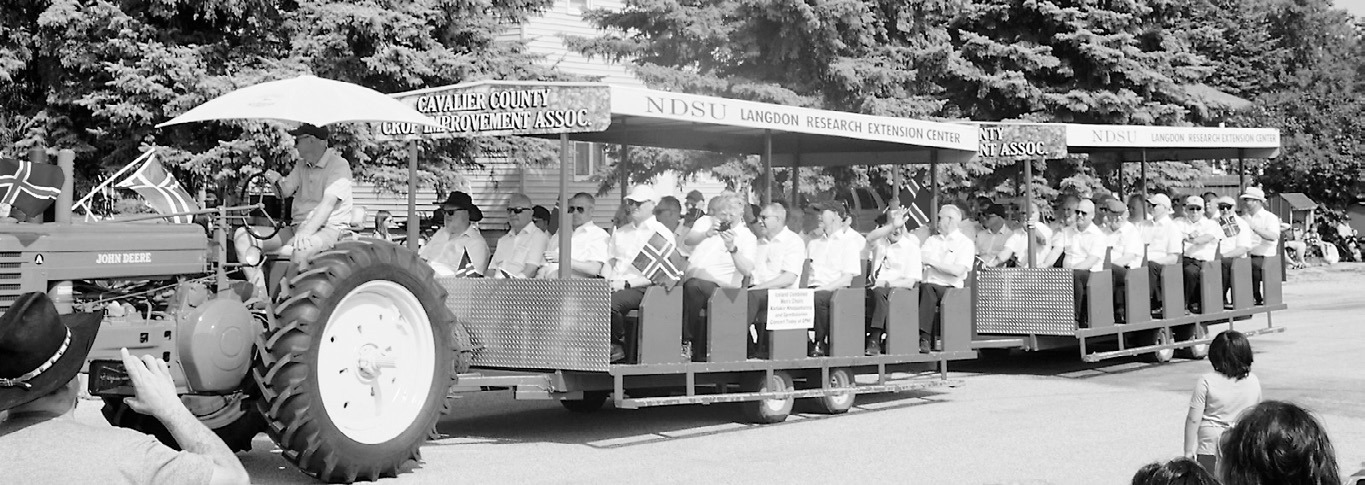 Visitors from Iceland ride on the Langdon Research Extension Center's wagons in the parade. Photo by Larry Stokke.