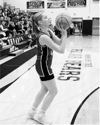 Hallie Overby chips in three points to help the Cards in the win over the Thunder on Tuesday night. Photo by Larry Stokke