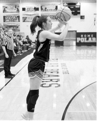 DVE Senior Jaelyn Johnson drops in a three-point basket against Benson County in the first round of the Region 2B Tournament. Photo by Larry Stokke